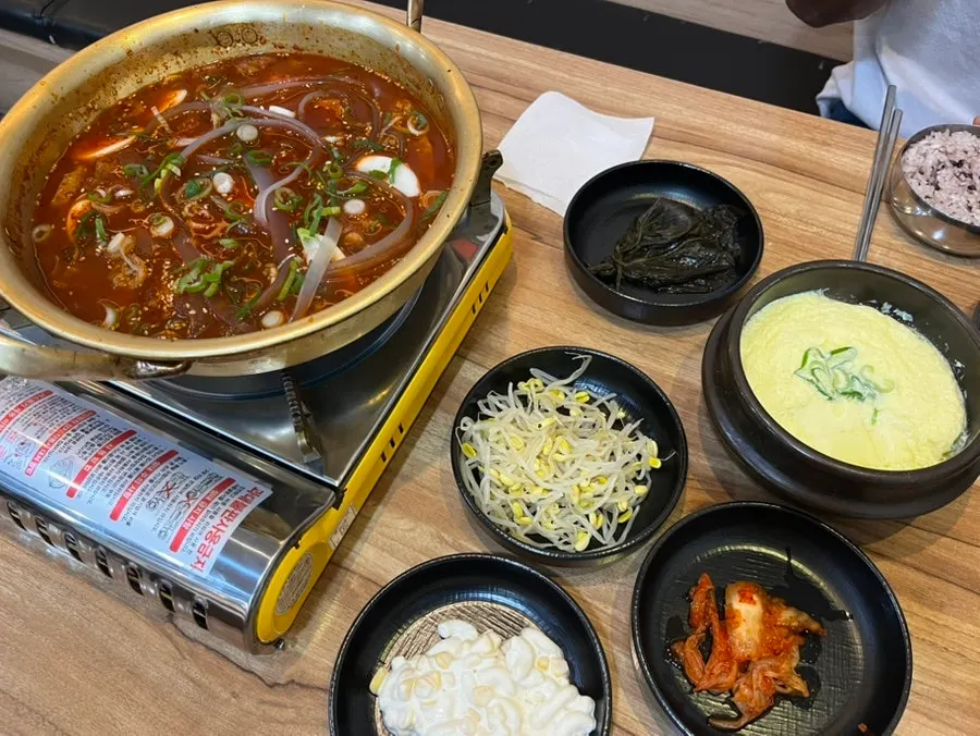 Pot of galbijjim with rice cakes, noodles, and ribs