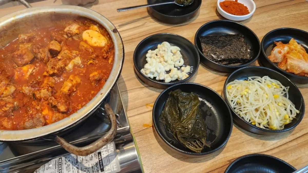 Full spread of galbijjim with extra spicy seasoning powder