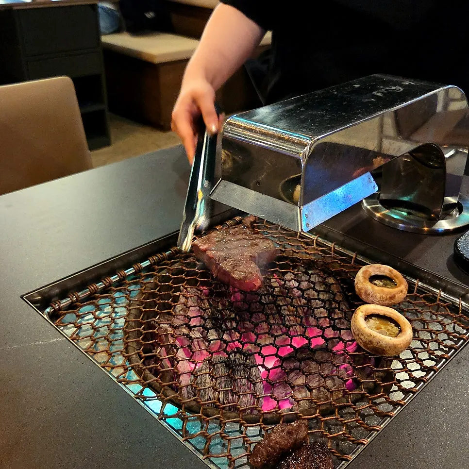 Aged beef placed over the charcoal grill