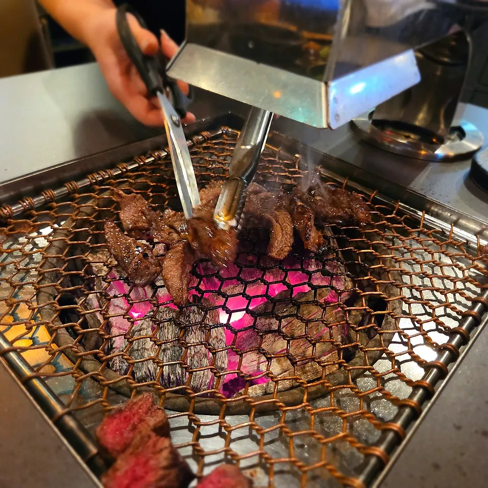 Prime sirloin cooking on the grill
