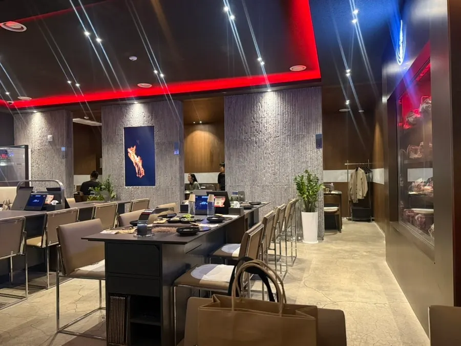 Wine and liquor display on one side of the restaurant