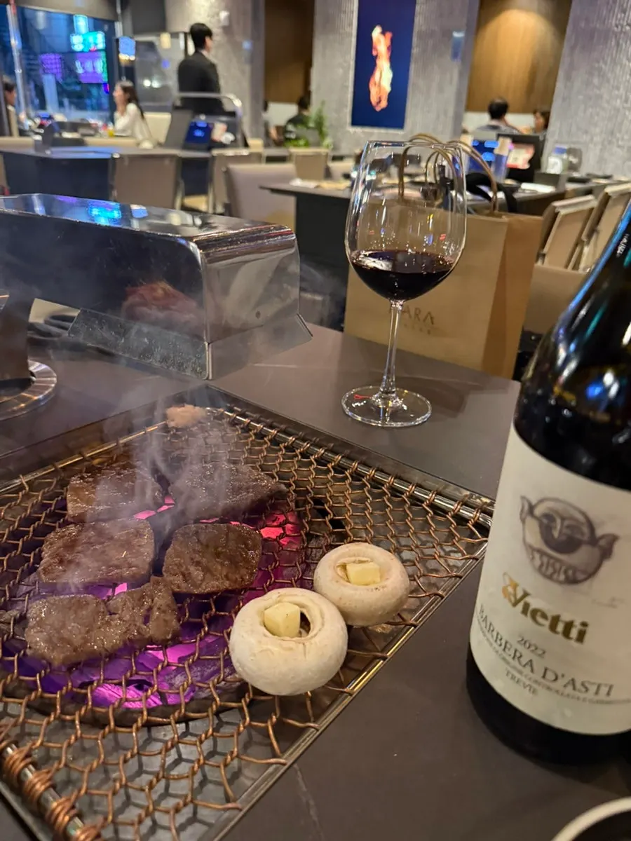 Beef cooking over charcoal