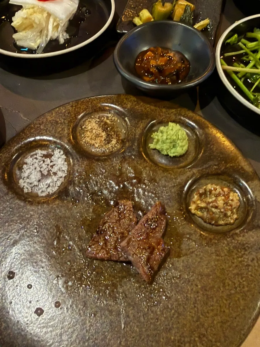 Meat placed on the tableside charcoal grill