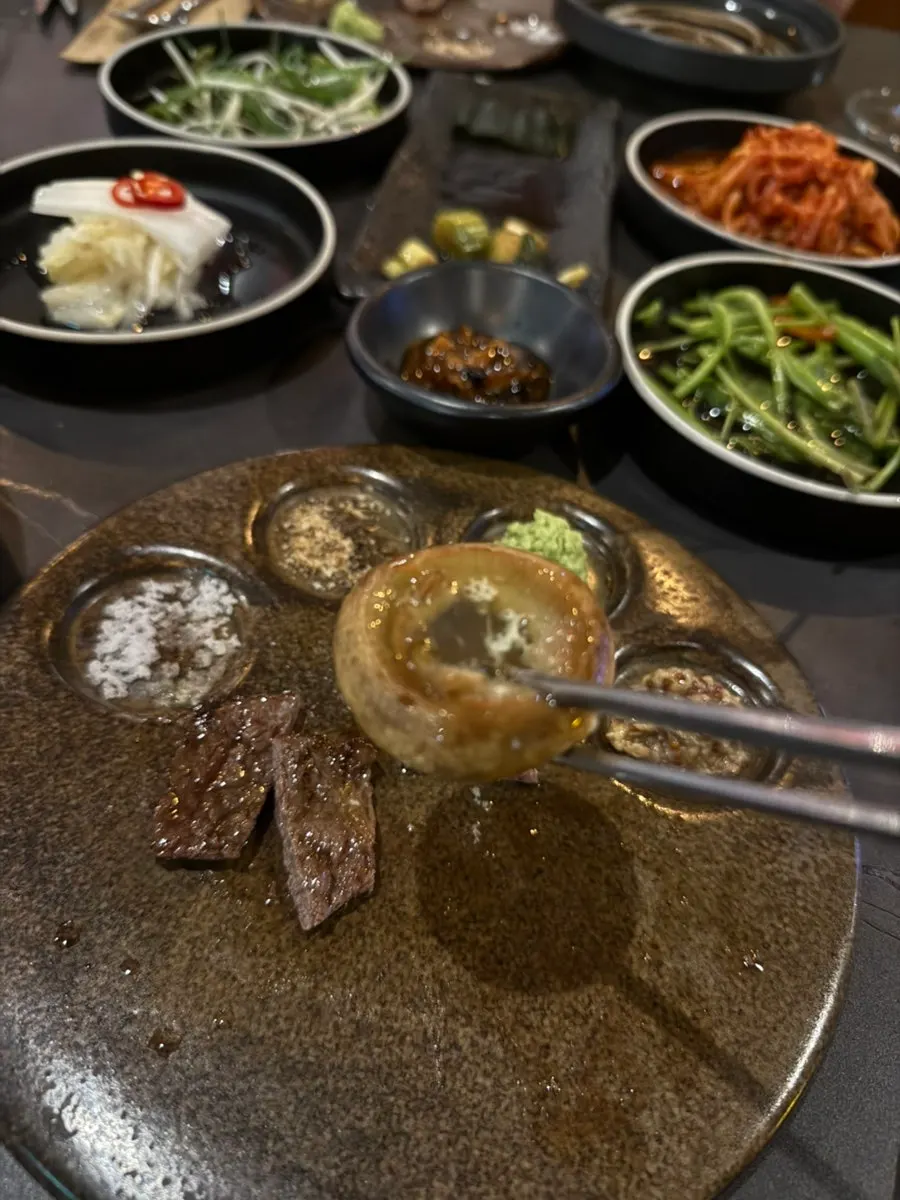 Basic banchan including white kimchi and scallion shreds
