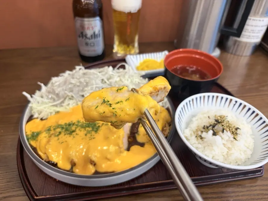 A plate of cheddar cheese sauce tonkatsu