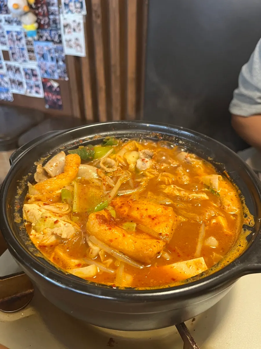 Eating the noodles in the rich broth like udon