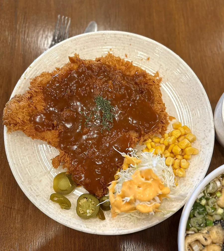Plate of large old-style pork cutlet