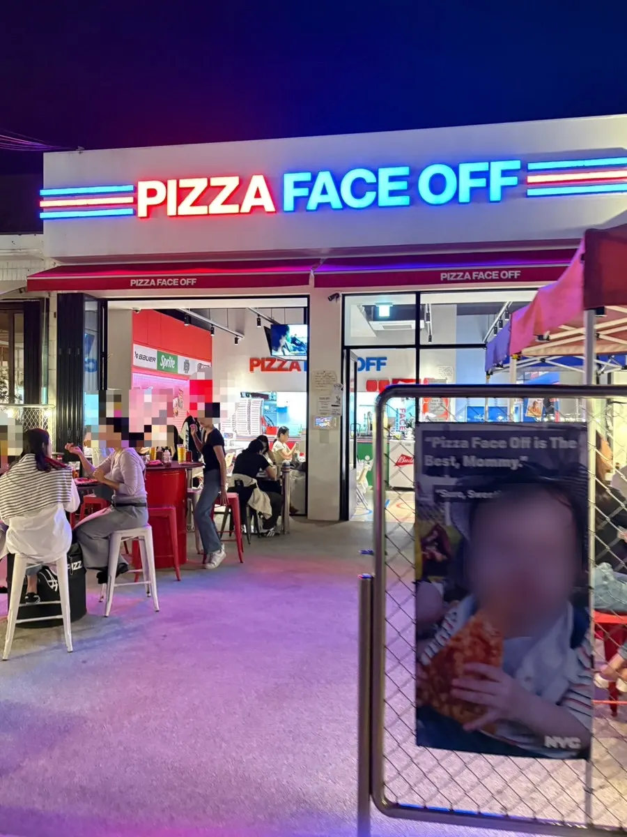 Fully booked outdoor tables at Pizza Face Off on a Friday evening