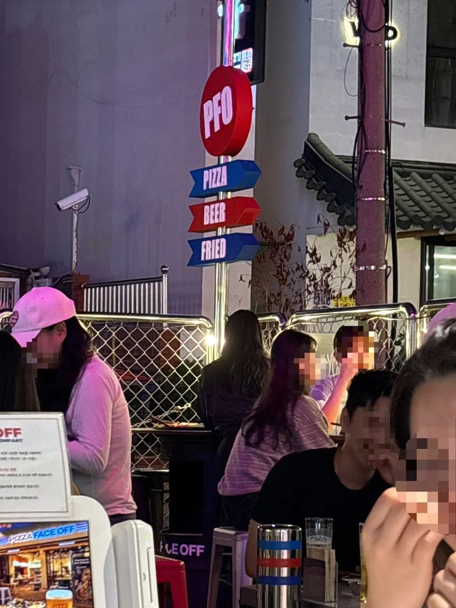 View of the restaurant front in the evening outdoor-seating atmosphere