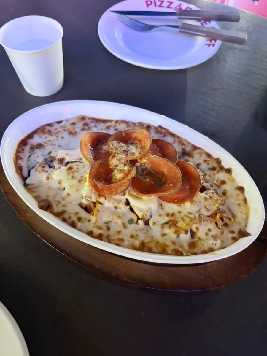 Tomato oven pasta piled high with cheese
