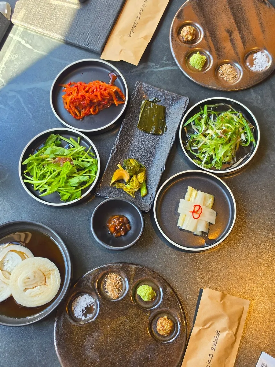 Side dishes spread on the black table
