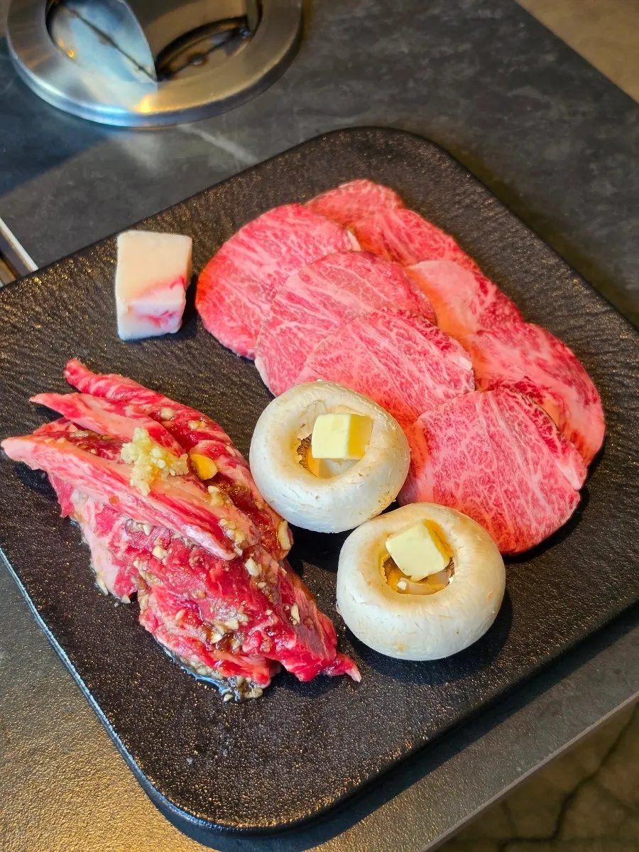 Plate of well-marbled raw Seonghwa Combo beef