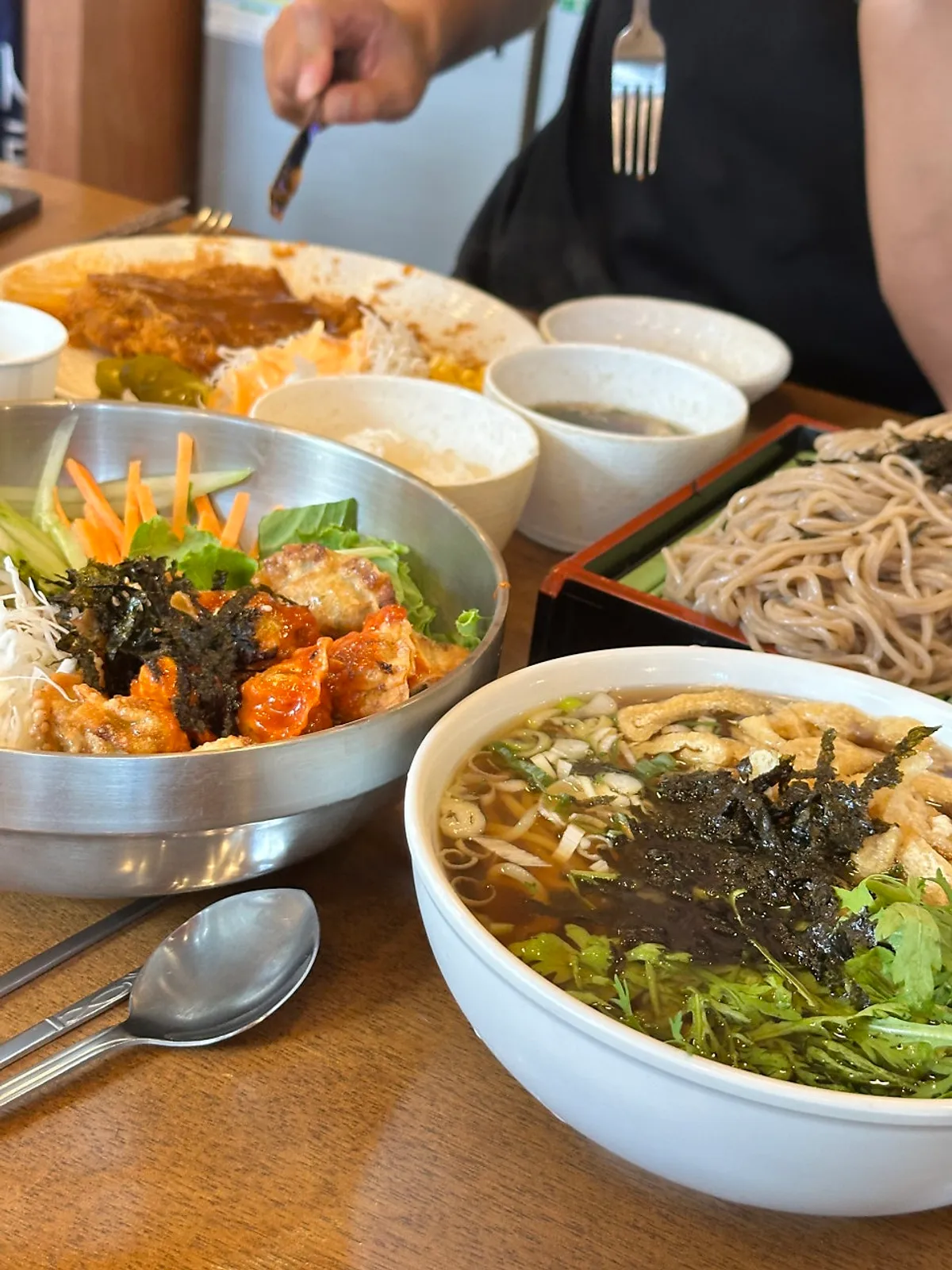 A bowl of bibim mandu loaded with vegetables
