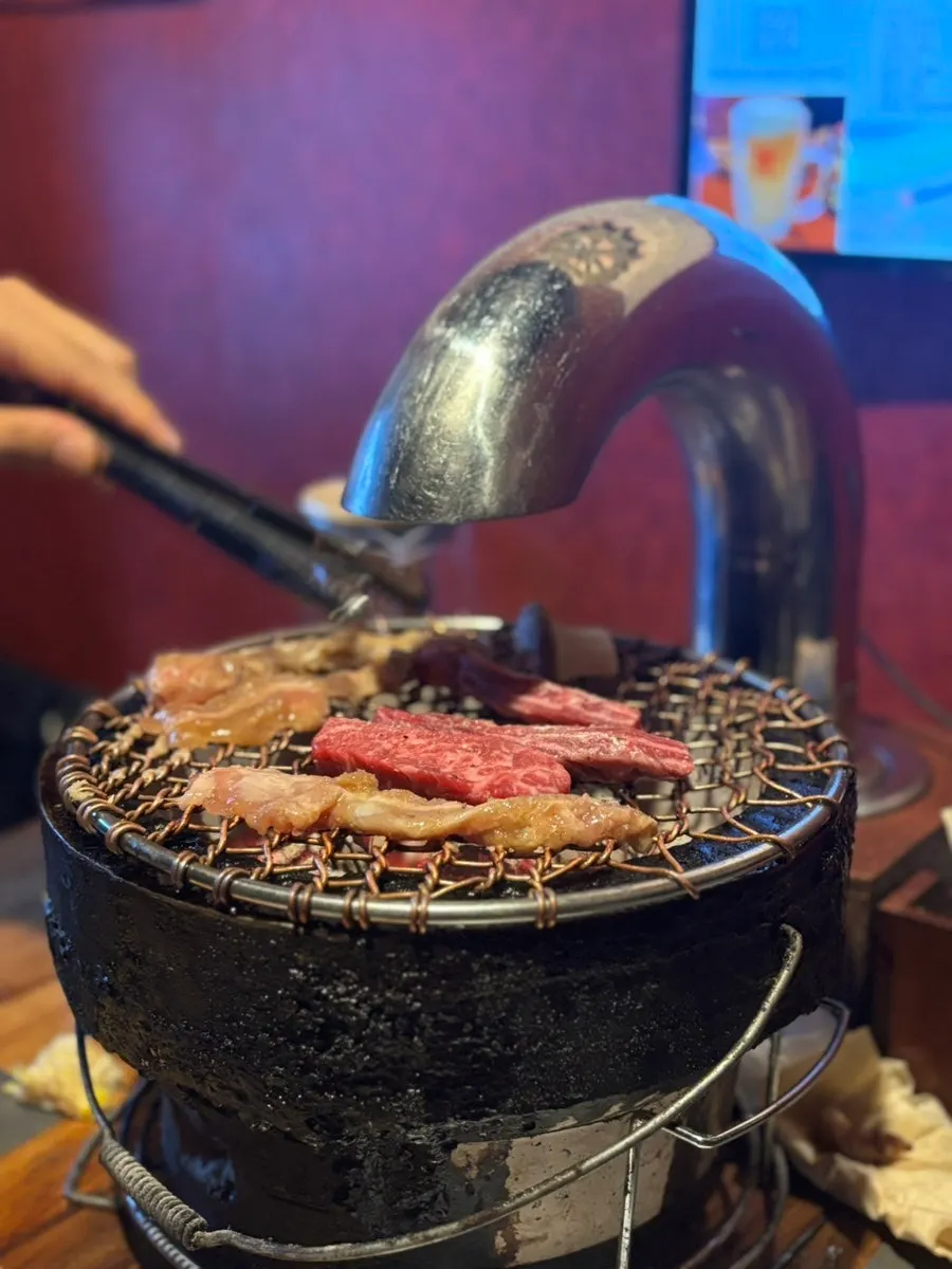 Yakiniku grilling on a charcoal brazier