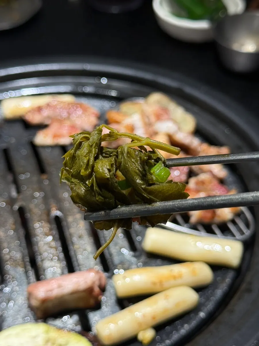 A piece of ribs topped with bangahip and ssamjang