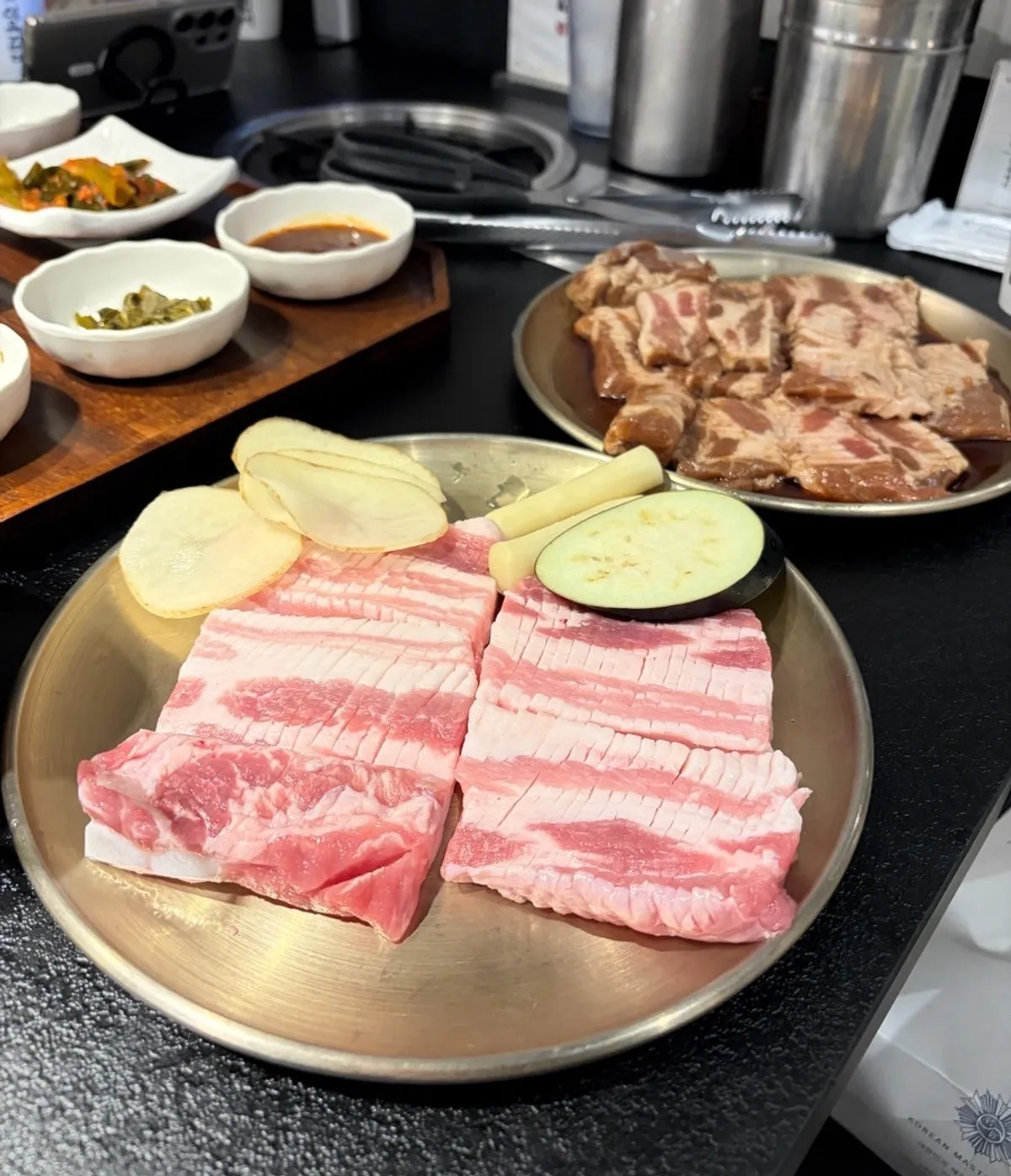 Seokok Galbi pork galbi and side dish spread