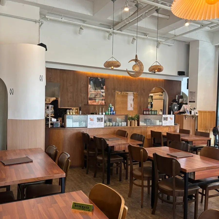 Wood-toned interior seating at Seoreojeong Munji Branch