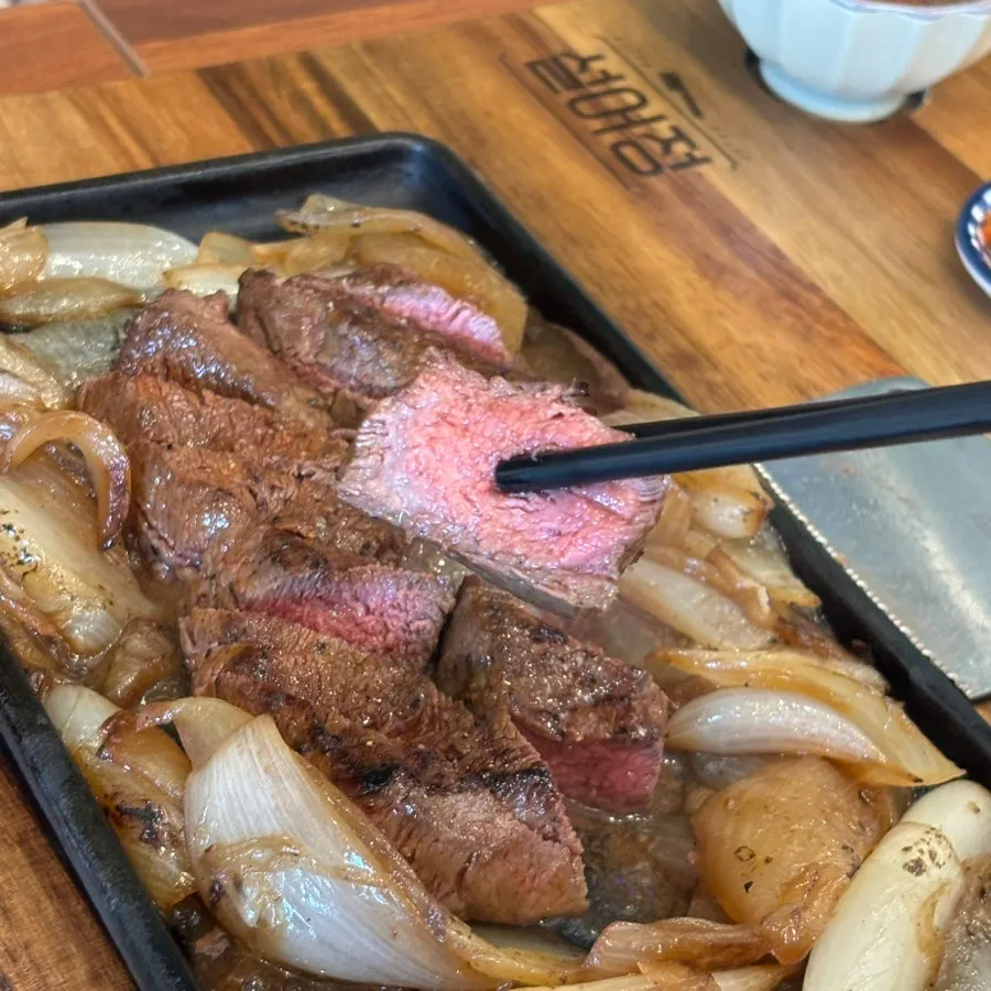 A piece of chuck flap steak served with wasabi