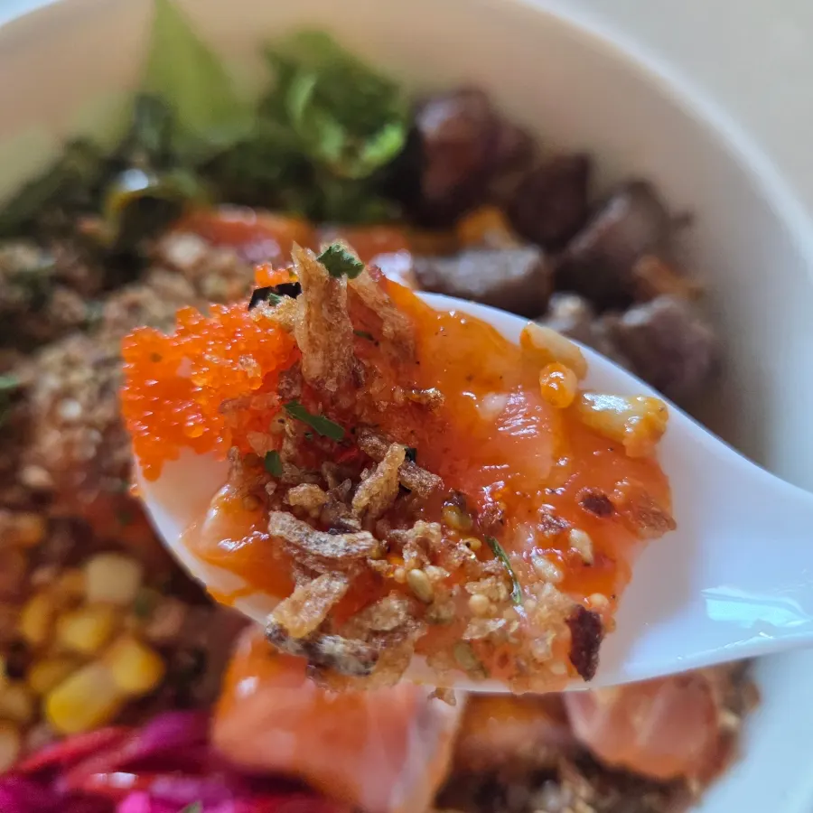 Poke mixed with salmon, steak, and vegetables