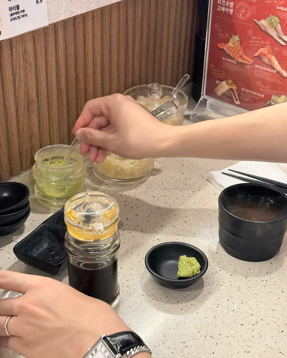 Wasabi and soy sauce scooped out at the counter seat
