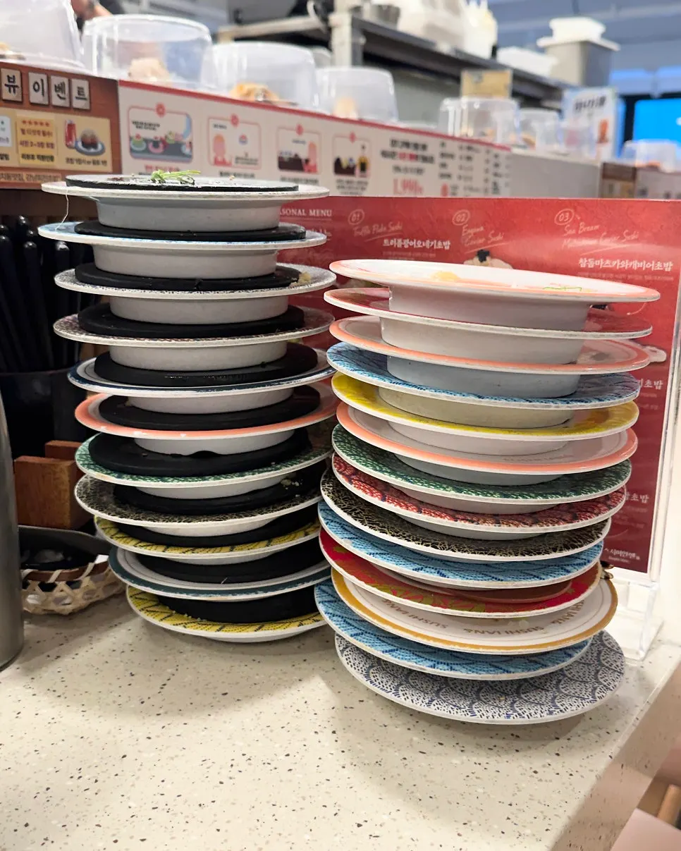A stack of finished sushi plates