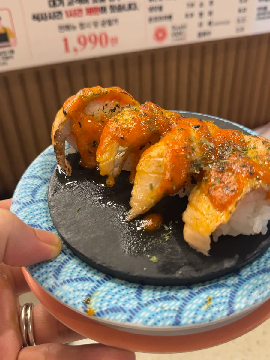 Salmon steak sushi with spicy fire chicken sauce