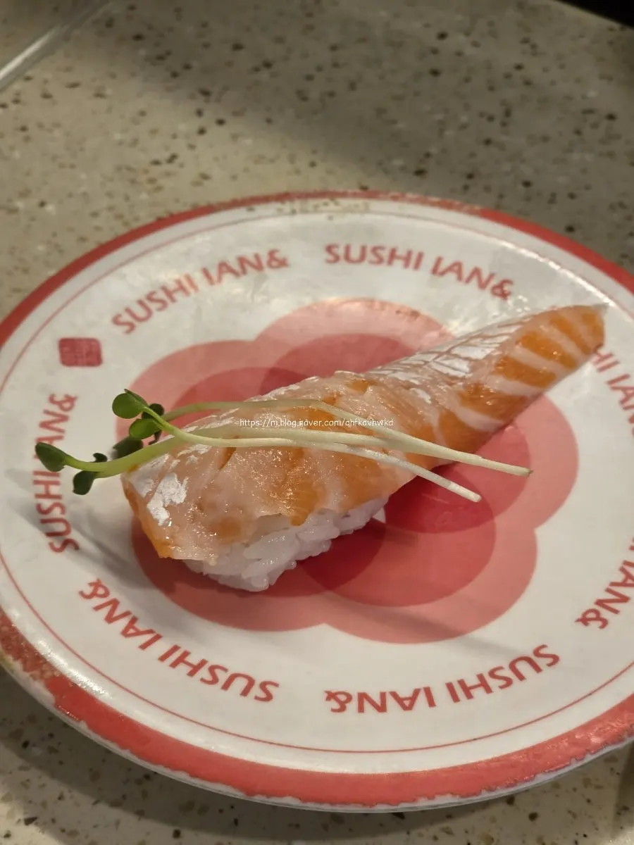 A plate of egg shrimp sushi