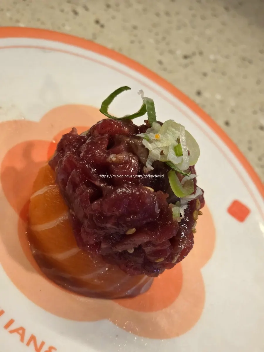 A plate of salmon yukhoe sushi