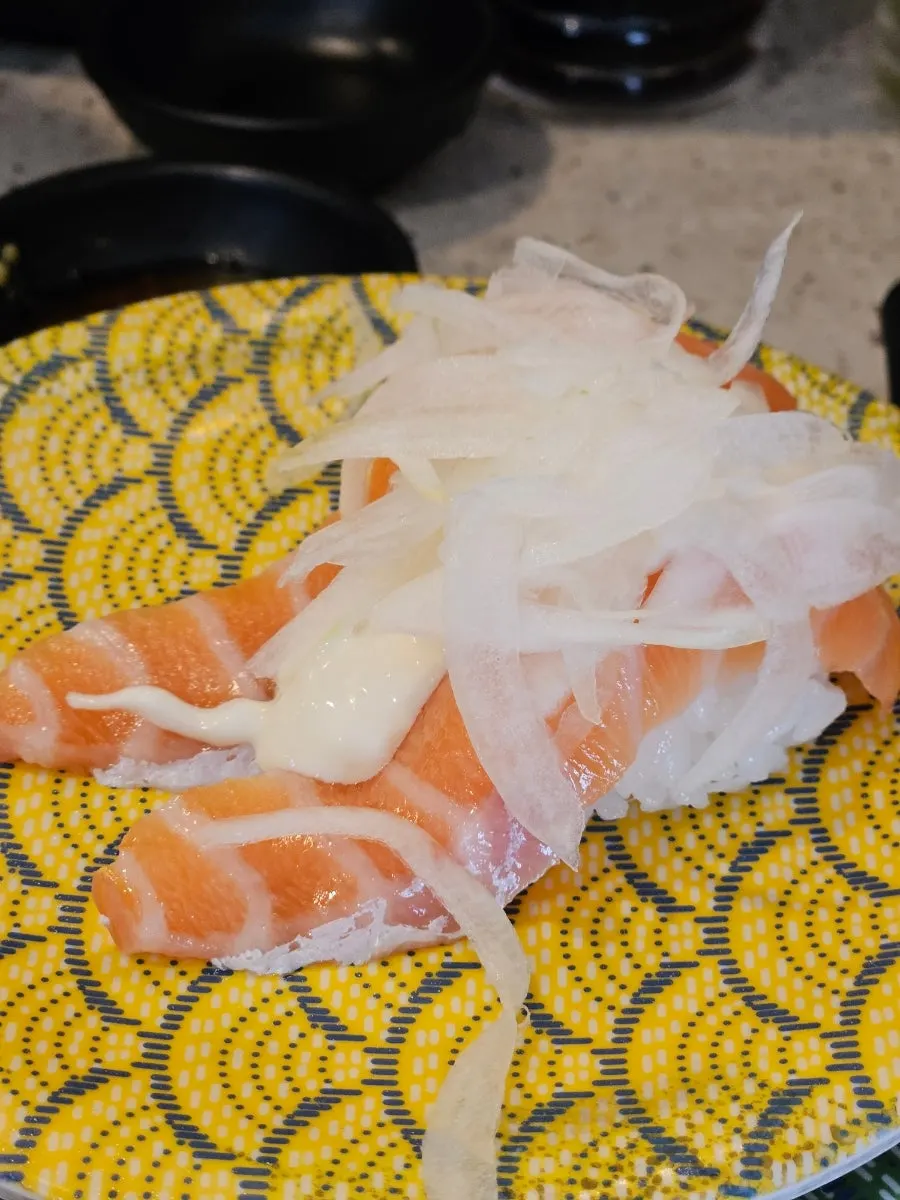Salmon tartare roll topped with beef tartare