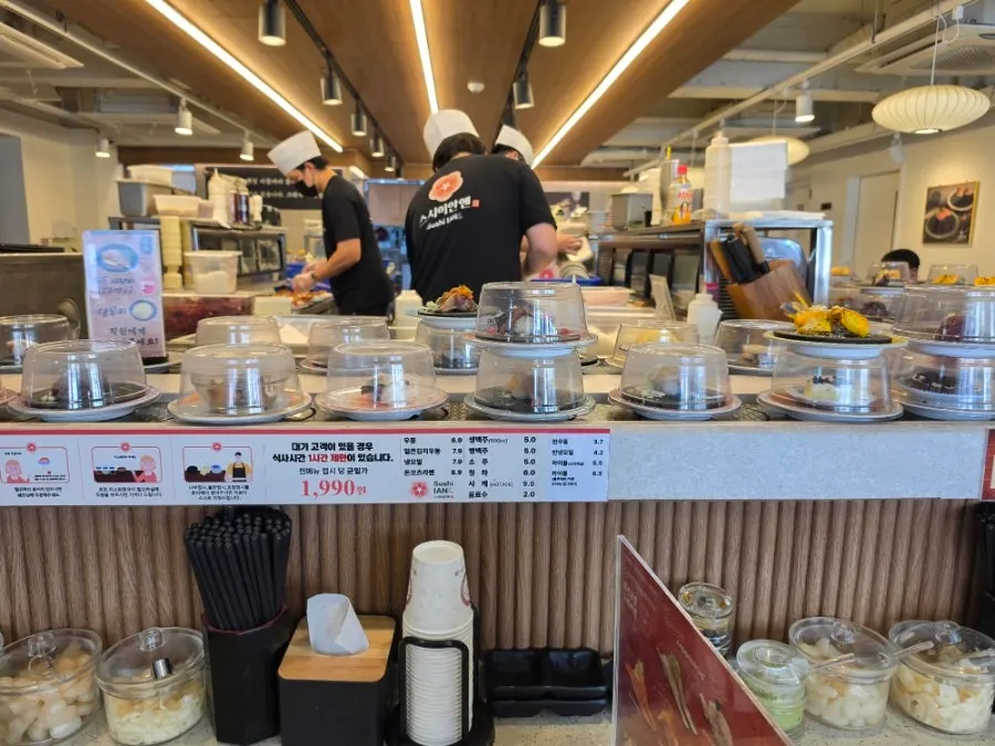 Sushi plate picked off the conveyor belt