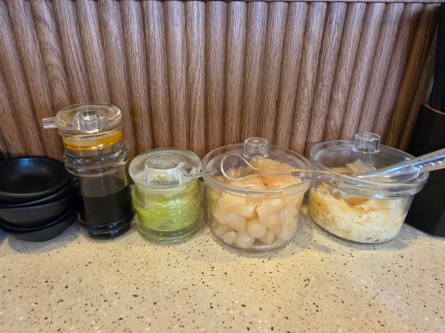 An assortment of conveyor-belt sushi plates