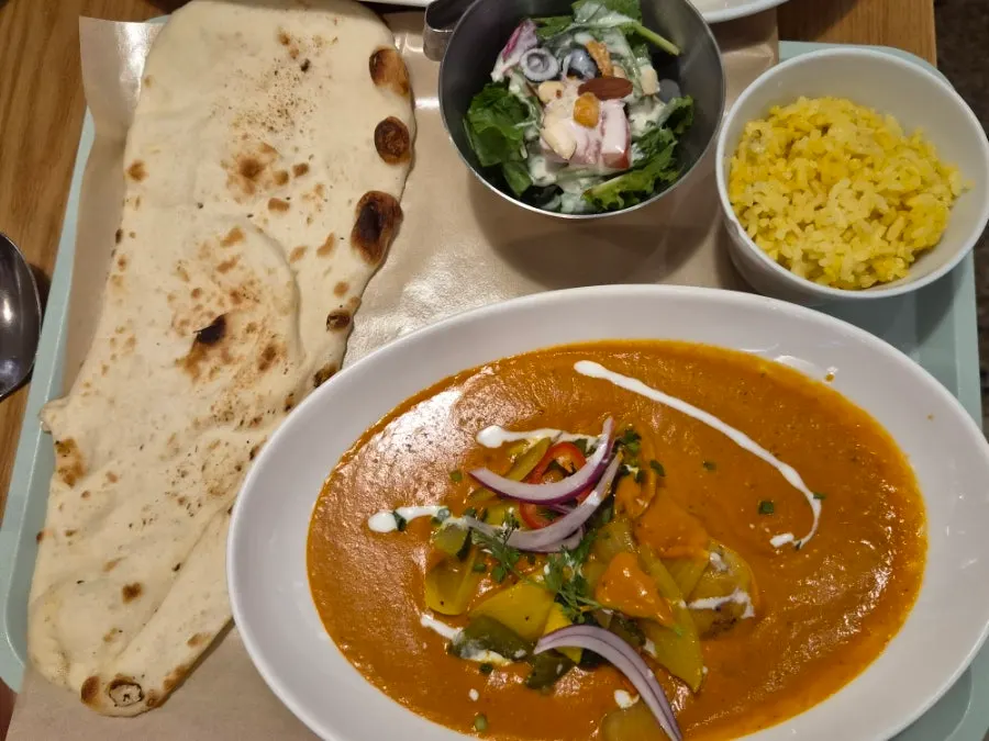 Enjoying curry and naan together