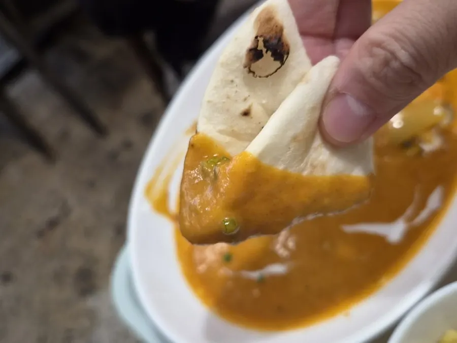 Warm naan and curry combination