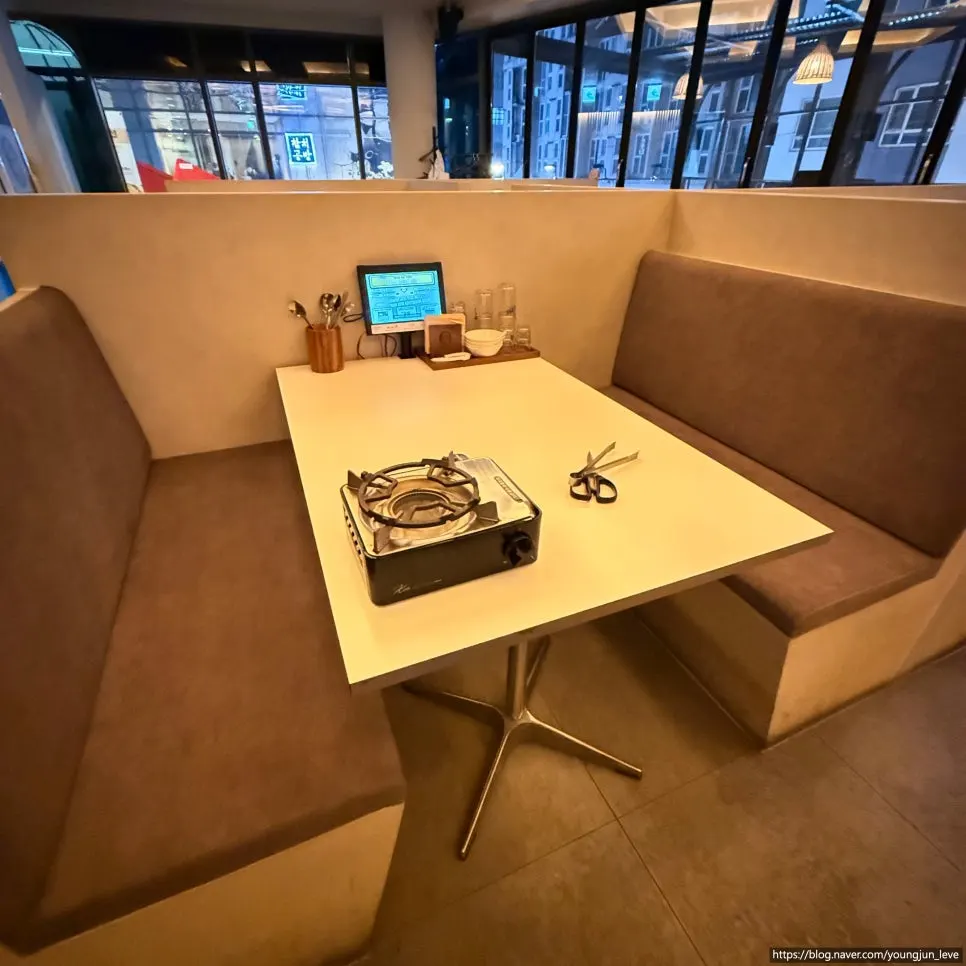 Wood-toned table seating at Seolleung Dowon