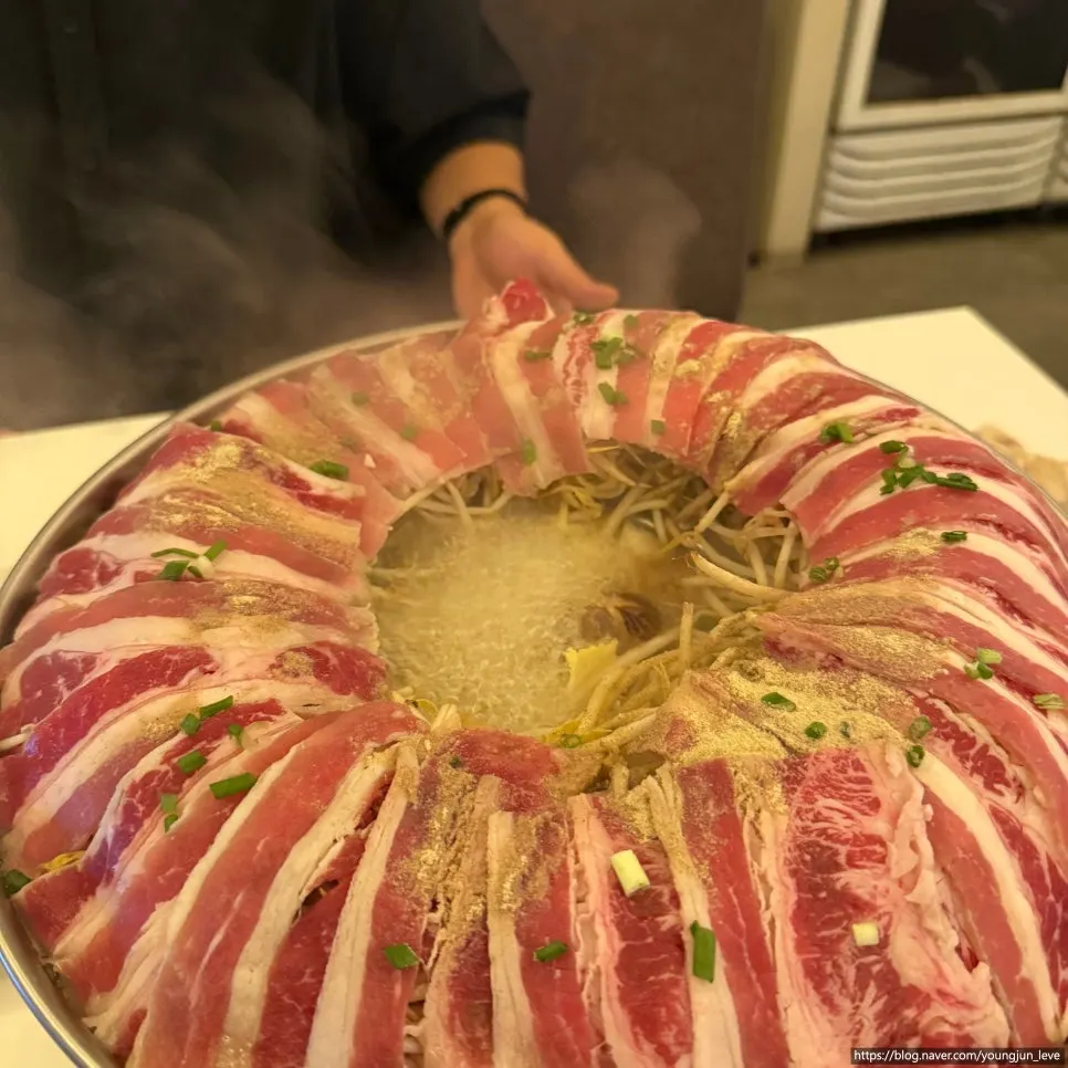 Dowon shabu broth and meat starting to boil