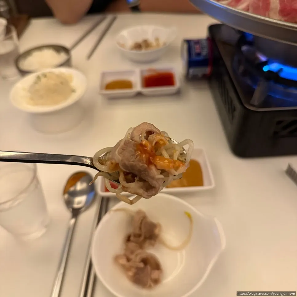 Meat and bean sprouts from dowon shabu dipped in sauce