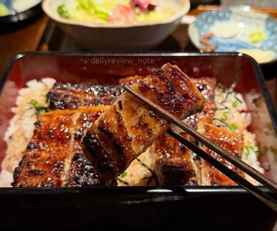 Table with eel rice bowl and side dishes