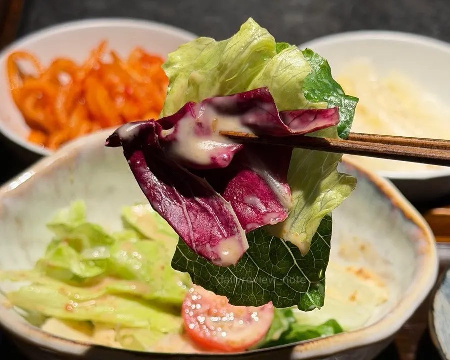 Manmok table setting including steamed egg custard and salad