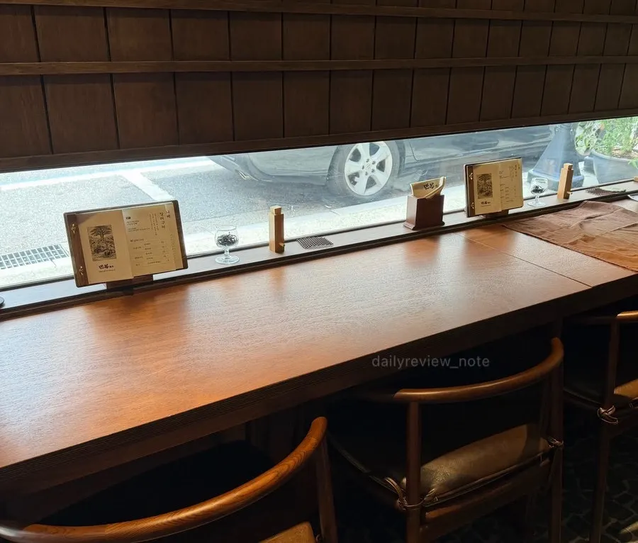 Bar-style seating facing the window