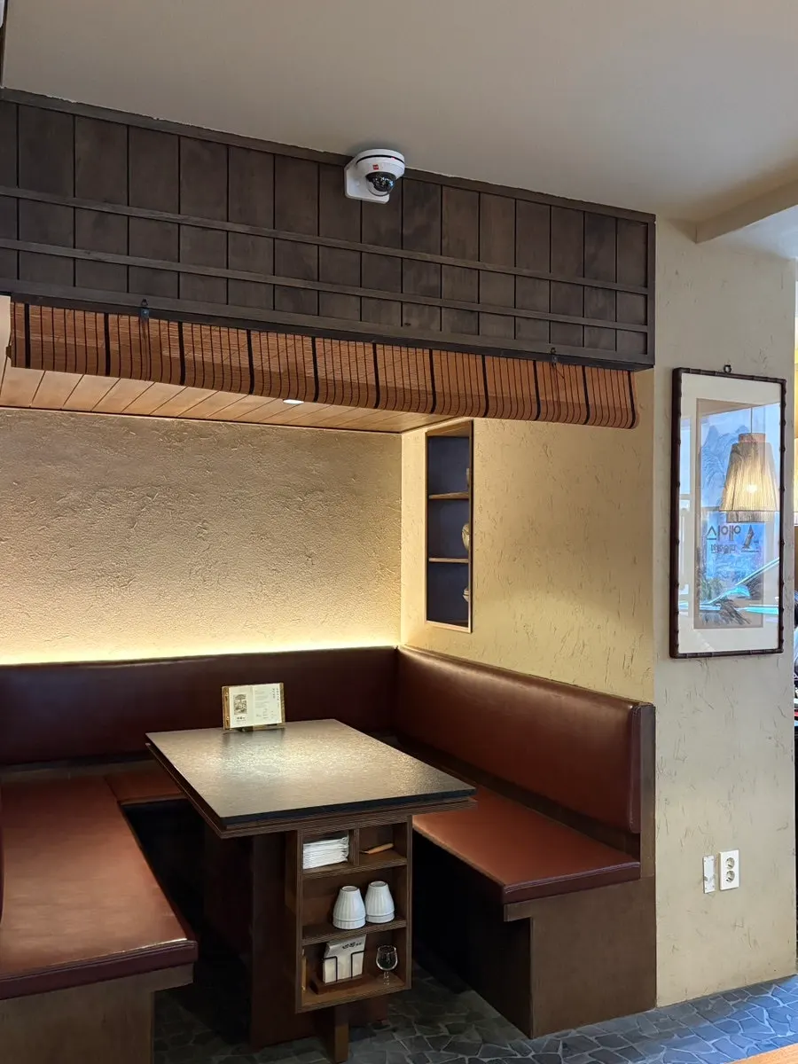 Solo seats and kitchen area to the left of Manmok’s entrance