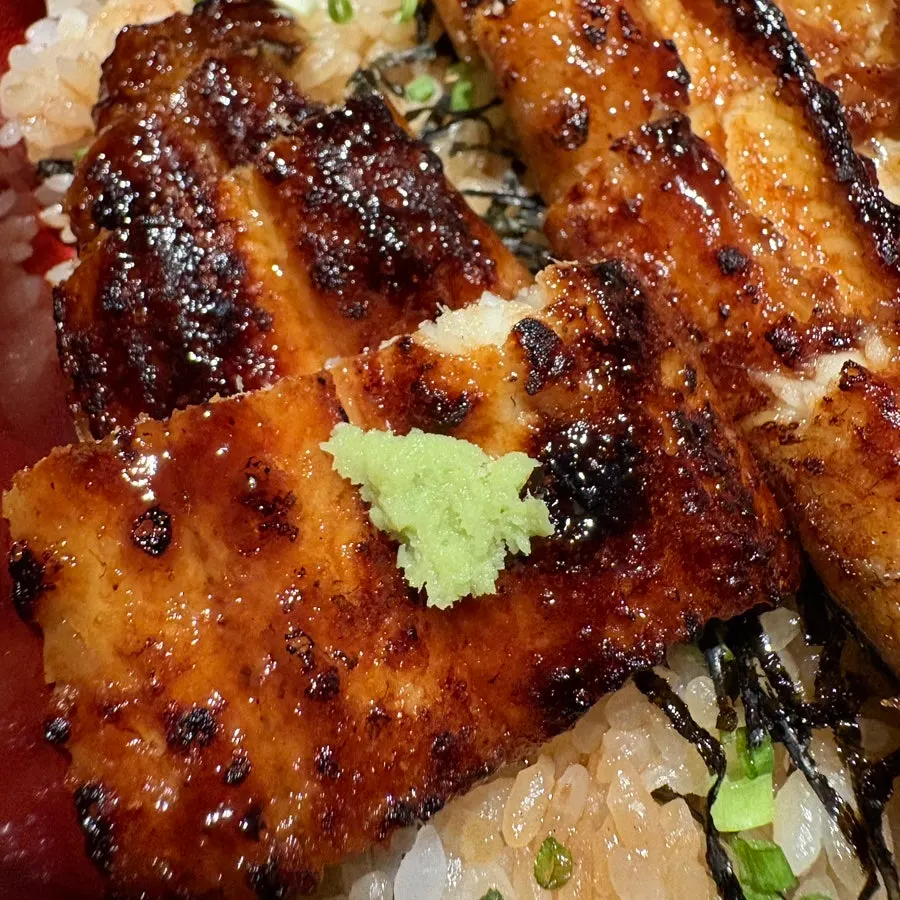 A piece of eel with wasabi