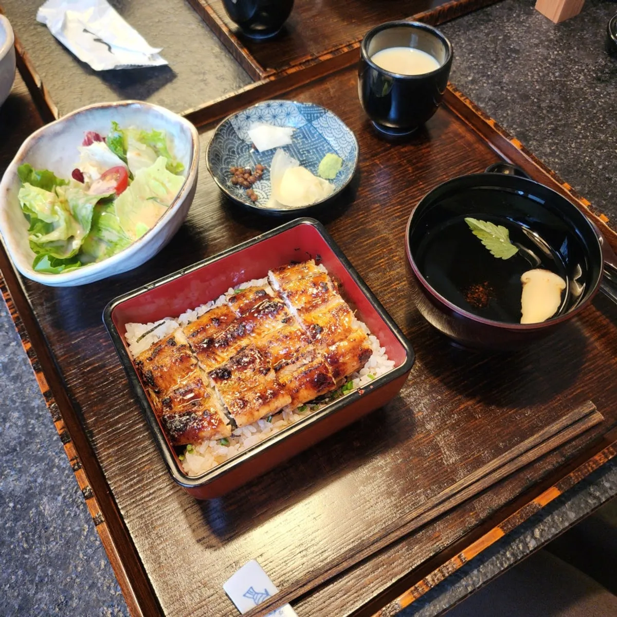 Manmok's charcoal-grilled eel rice bowl in a square container