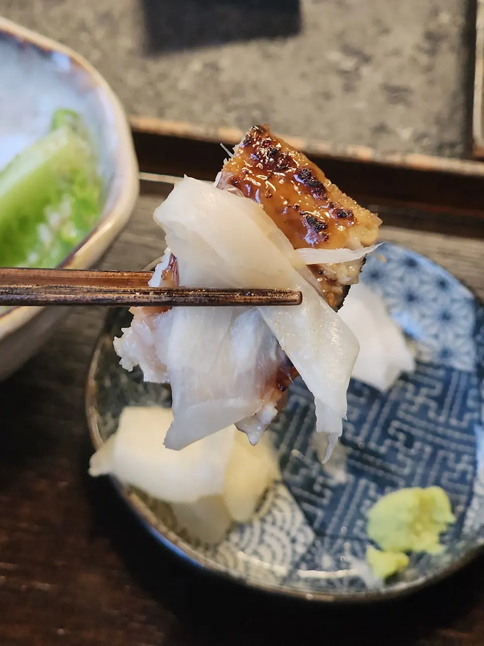 A bite of eel rice bowl lifted with rice