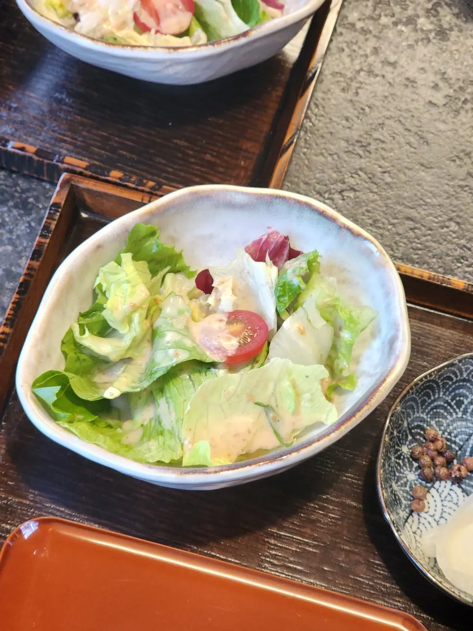 Manmok's salad topped with sesame dressing