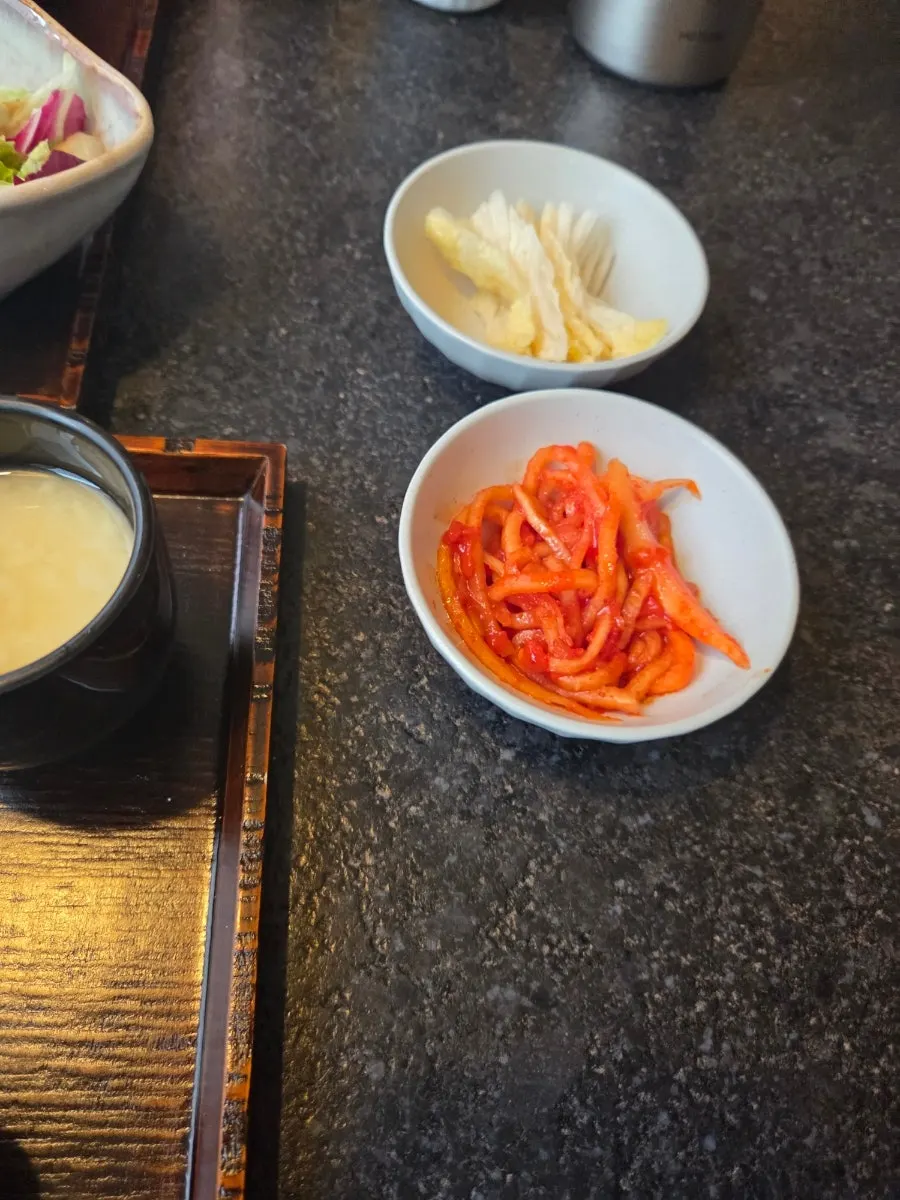 Eel rice bowl with baek-kimchi and ginger