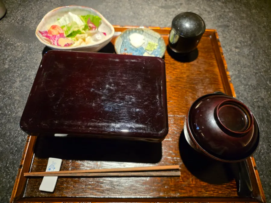 Eel rice bowl in a closed bento-style box