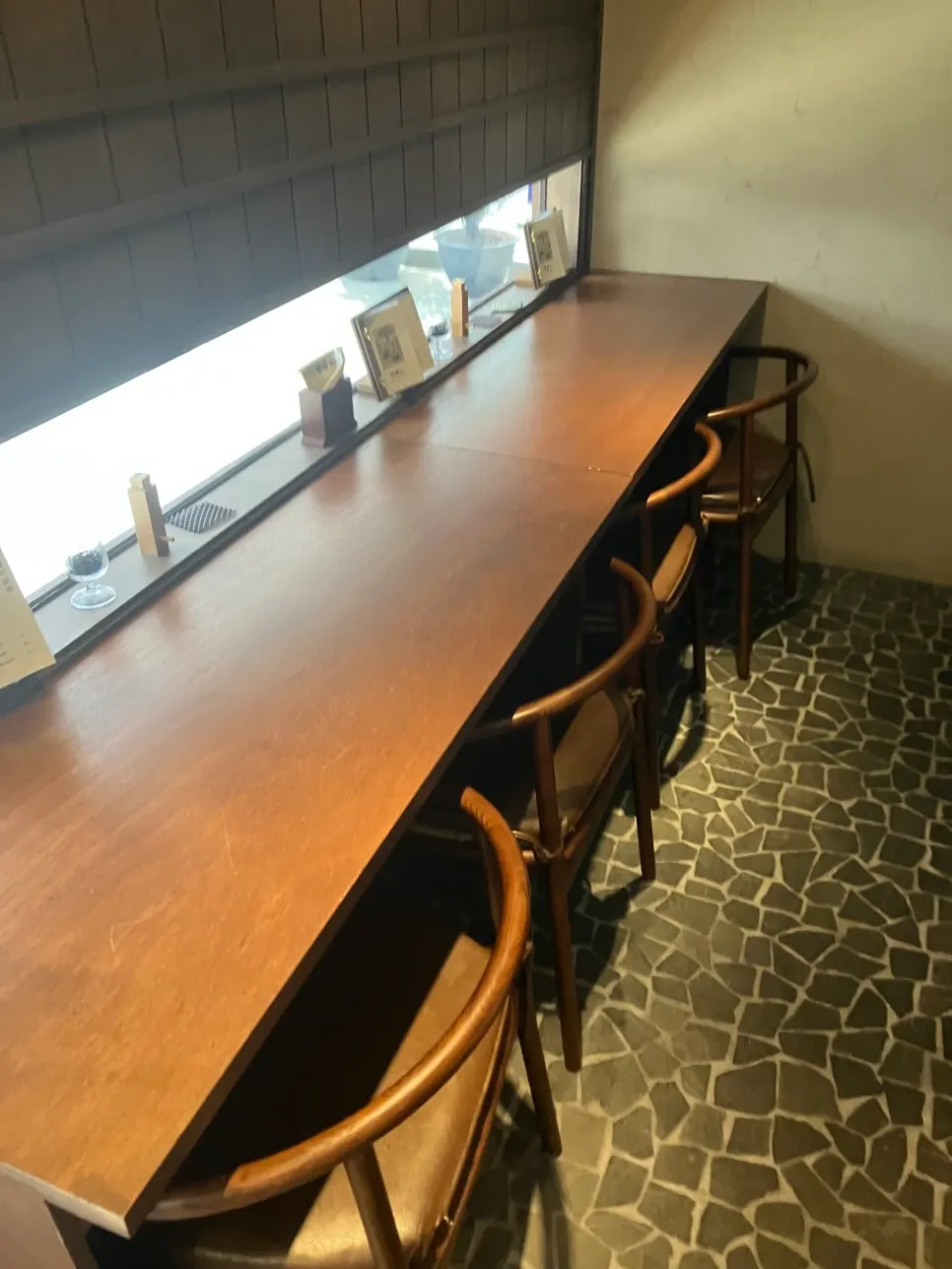 Manmok interior with calm lighting and wood furnishings
