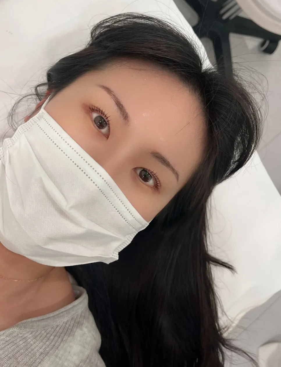 Lash lift treatment in progress with eyes closed
