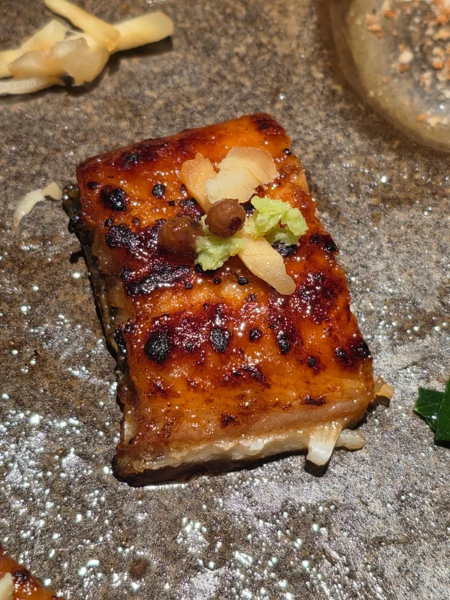 A spoonful of rice with seasoned eel