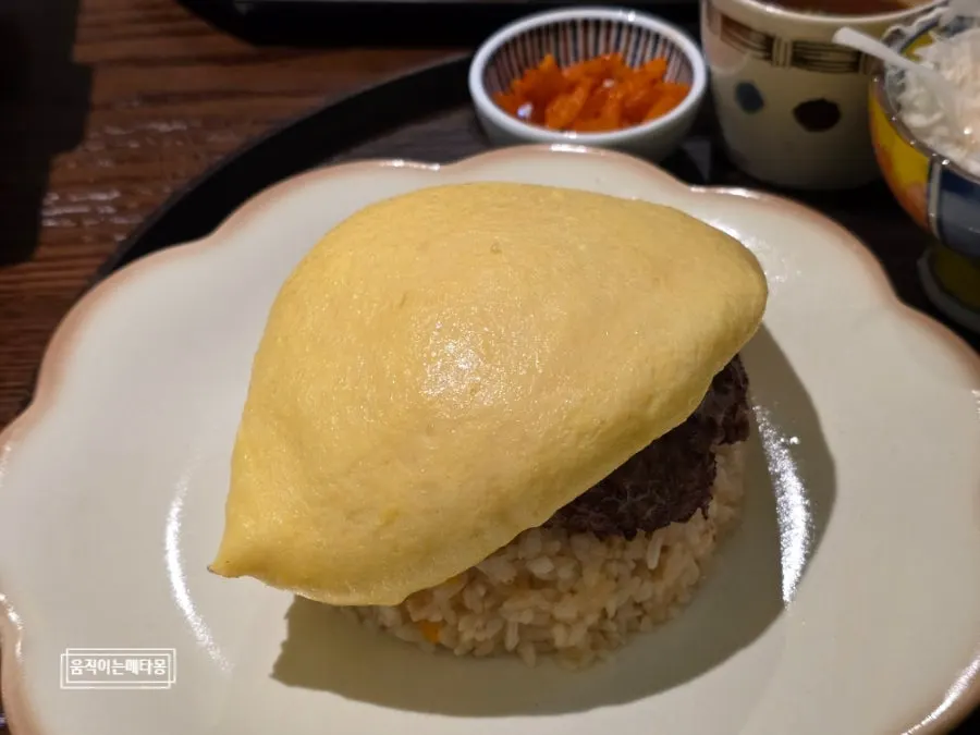 Omurice topped with hamburg steak patty